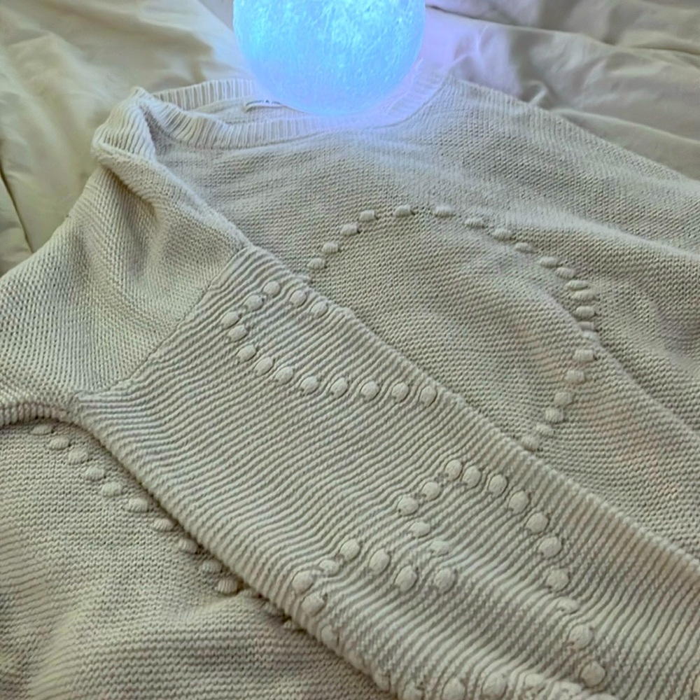 Heart knitted white sweater.